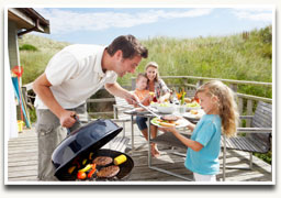 Family grilling in the backyard