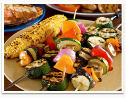 Image of family grilling in backyard